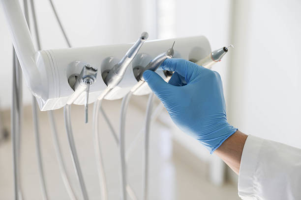Professional Tooth Extraction technician working in Mount Holly, NC